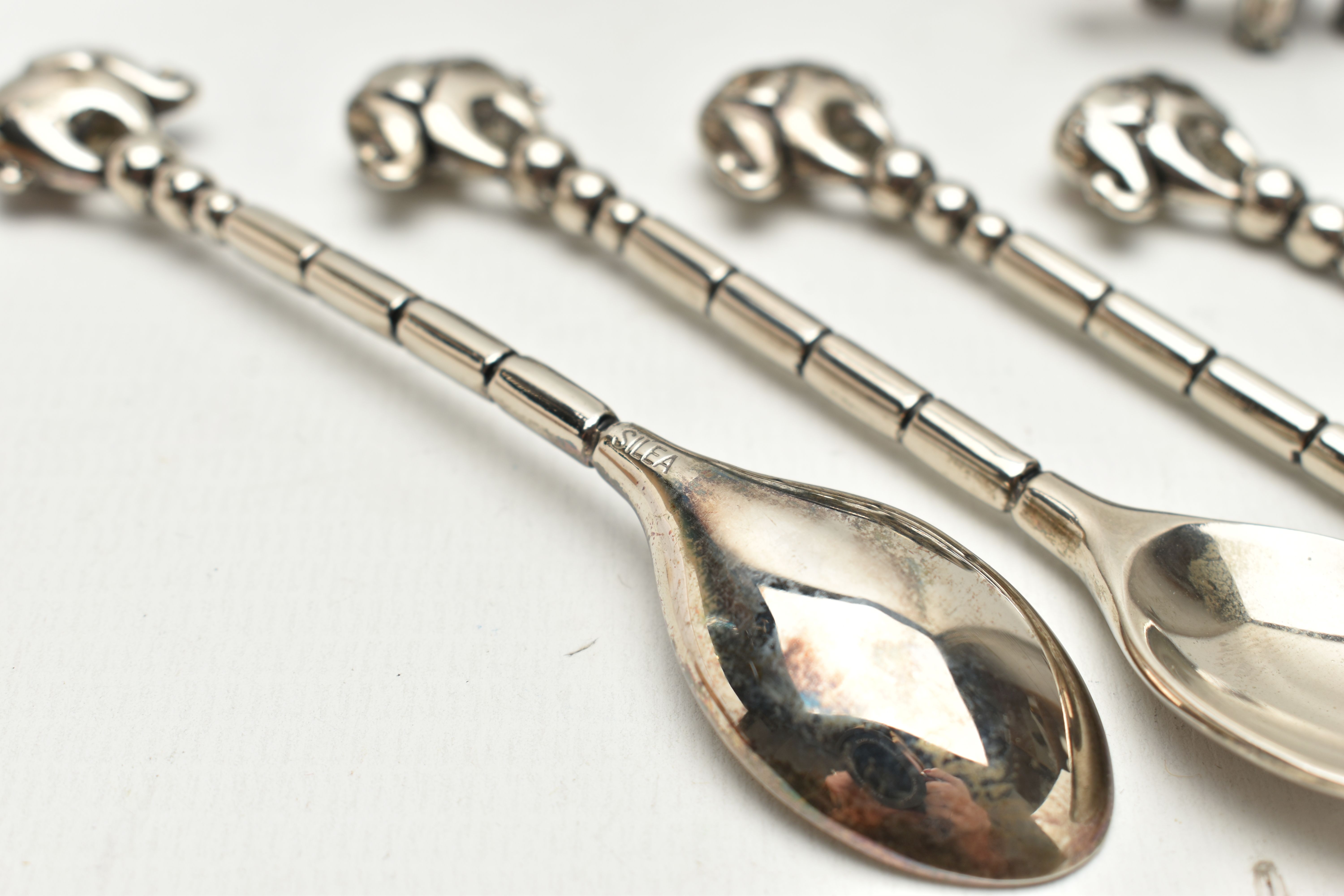 AN EDWARDIAN SILVER ELEPHANT PIN CUSHION, TWO OTHERS AND FOUR SPOONS, realistically stylised - Image 3 of 3