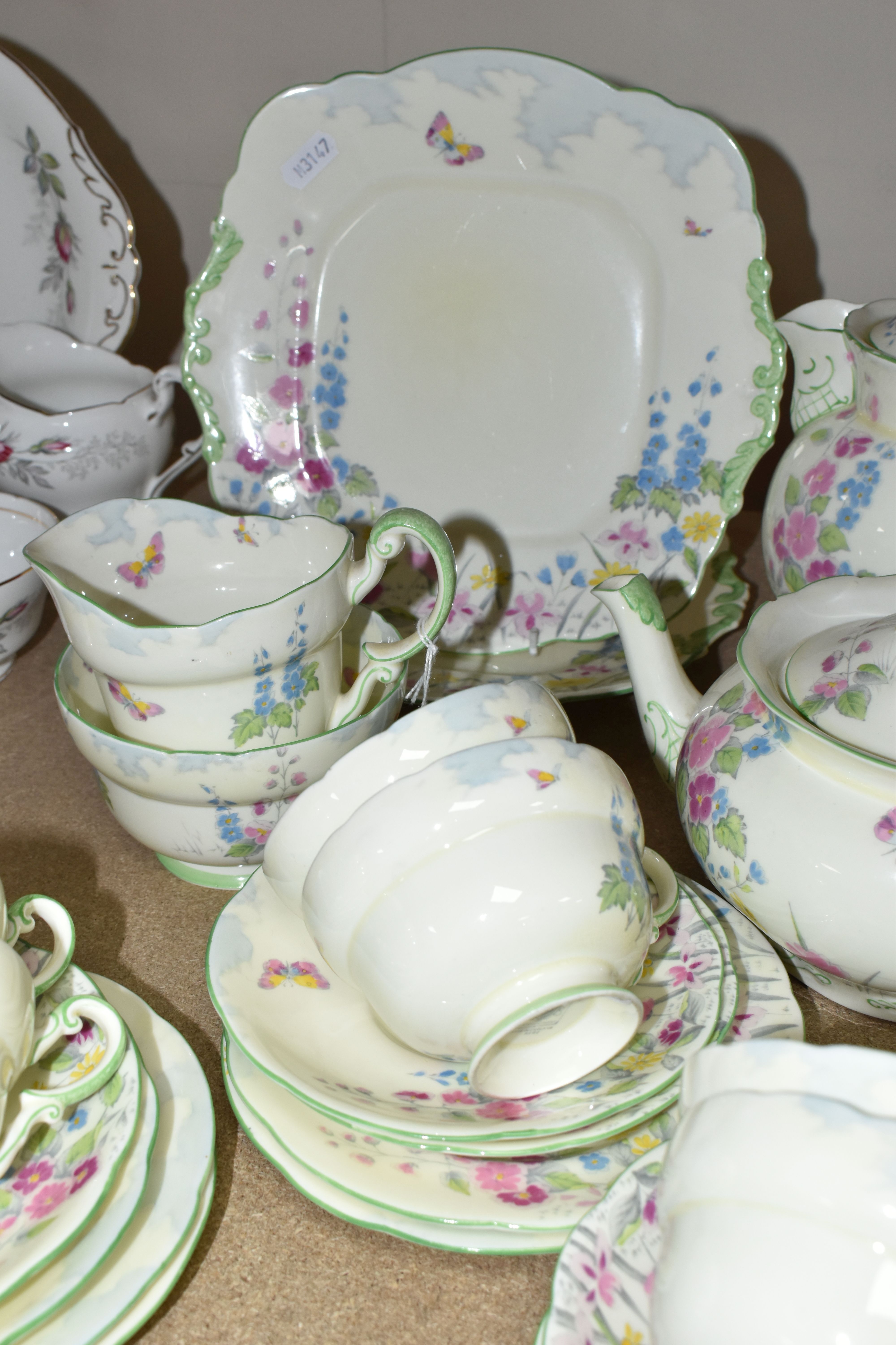 TWO PARAGON TEA SETS, comprising a twenty four piece tea set printed and tinted with butterflies, - Image 5 of 12