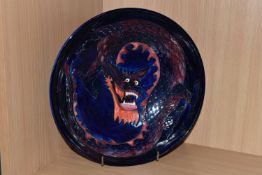 A MOORCROFT DRAGON BOWL, designed by Trevor Critchlow for Moorcroft, a bowl decorated with a red and