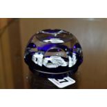 A FRENCH BACCARAT ZODIAC FACETED GLASS PAPERWEIGHT, with a cobalt blue base and central white '