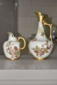 TWO ROYAL WORCESTER IVORY GROUND EWERS, both printed and painted with sprays of flowers, the