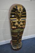 A REPRODUCTION WOODEN SINGLE DOOR CABINET, in the form of an Egyptian Sarcophagus Pharaoh mummy,