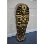 A REPRODUCTION WOODEN SINGLE DOOR CABINET, in the form of an Egyptian Sarcophagus Pharaoh mummy,