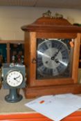 TWO CLOCKS, comprising a stone cased, cube shaped Daymaster clock, with thermometer, barometer and