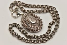 A VICTORIAN SILVER LOCKET, oval locket with etched foliage detail and beading surround,