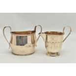 A LATE VICTORIAN SILVER TWIN HANDLED SUGAR BOWL OF OVAL FORM AND A GEORGE V SILVER MILK JUG, the