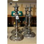 FOUR SILVER PLATED CANDLESTICKS, two pairs of plated copper candlesticks with extinguishers,
