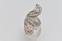 A WHITE METAL DRESS RING, large dress ring set with colourless cubic zirconia and three synthetic