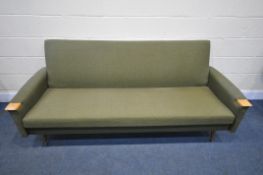 A MID-CENTURY GREEN VELOUR UPHOLSTERED BED SETTEE, with beech armrests, length 203cm x depth 85cm