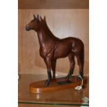 A BESWICK CONNOISSEUR MODEL OF RED RUM, model no.2510, a second, matt, on a titled oval wooden