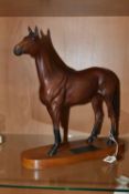 A BESWICK CONNOISSEUR MODEL OF RED RUM, model no.2510, a second, matt, on a titled oval wooden