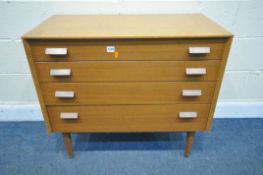 A MID CENTURY E-GOMME/G-PLAN LIGHT OAK AND TEAK CHEST OF FOUR DRAWERS, on cylindrical legs, width