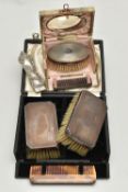TWO MID 20TH CENTURY CASED SILVER MOUNTED BRUSH AND COMB SETS, comprising a case containing a pair