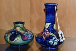 TWO MOORCROFT POTTERY VASES DECORATED IN THE ORCHID AND SPRING FLOWERS PATTERN, comprising squat