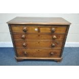 A GEORGIAN WALNUT CHEST OF TWO SHORT OVER THREE LONG GRADUATED DRAWERS, the canted front corners