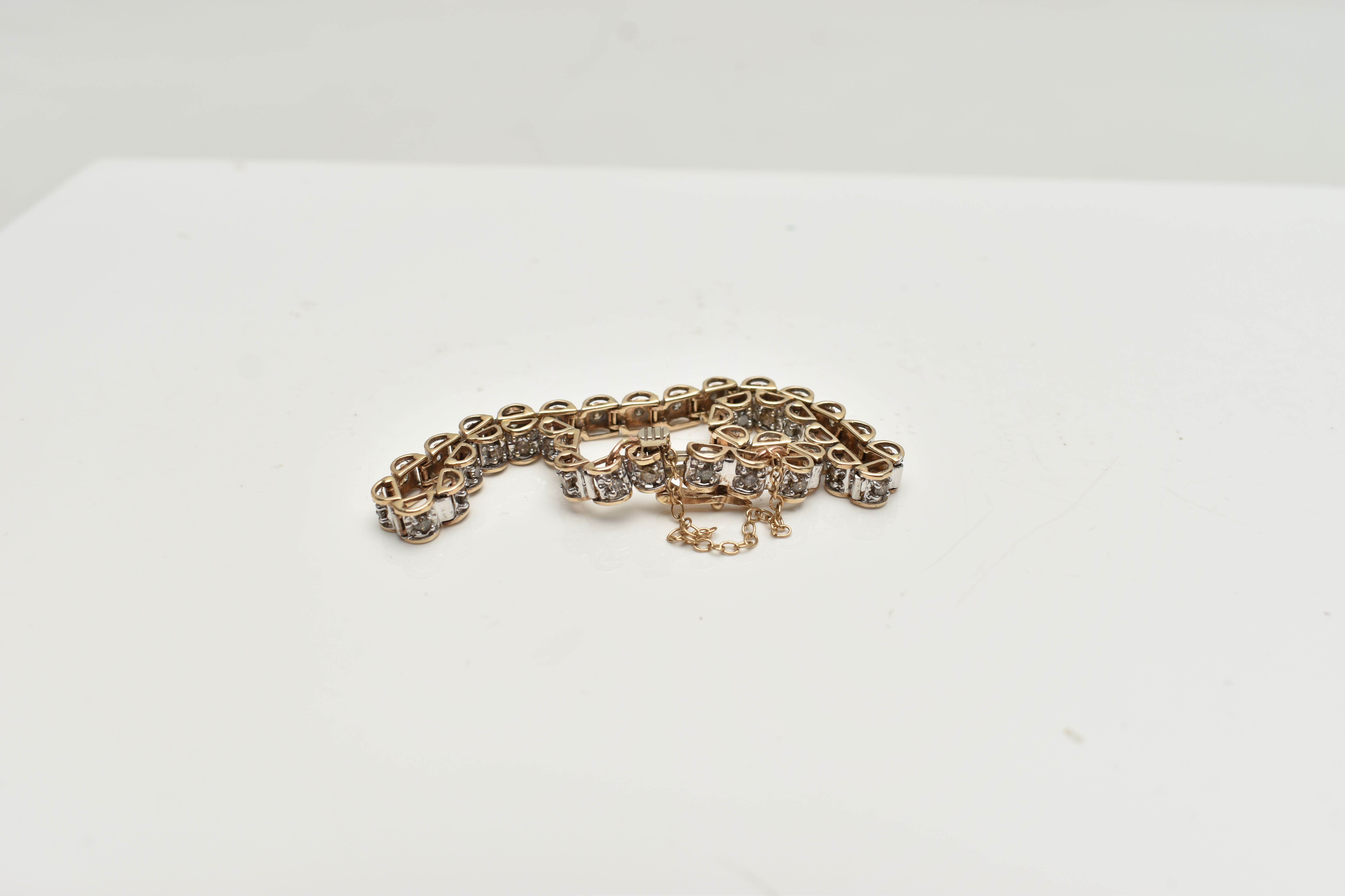 A 9CT GOLD DIAMOND LINE BRACELET, designed as a series of box links each set with a small round - Image 3 of 3