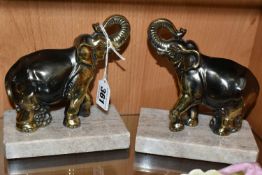 A PAIR OF FRENCH ART DECO STYLE CAST METAL ELEPHANT BOOKENDS, on rectangular marble plinths,