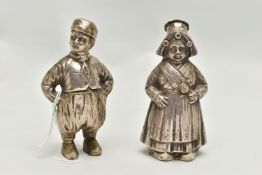 A PAIR OF 20TH CENTURY CONTINENTAL WHITE METAL PEPPERETTES IN THE FORM OF A DUTCH BOY AND GIRL