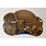 TWO ART DECO STYLE WALL MIRRORS, comprising a rose coloured mirror in the form of a cloud and an