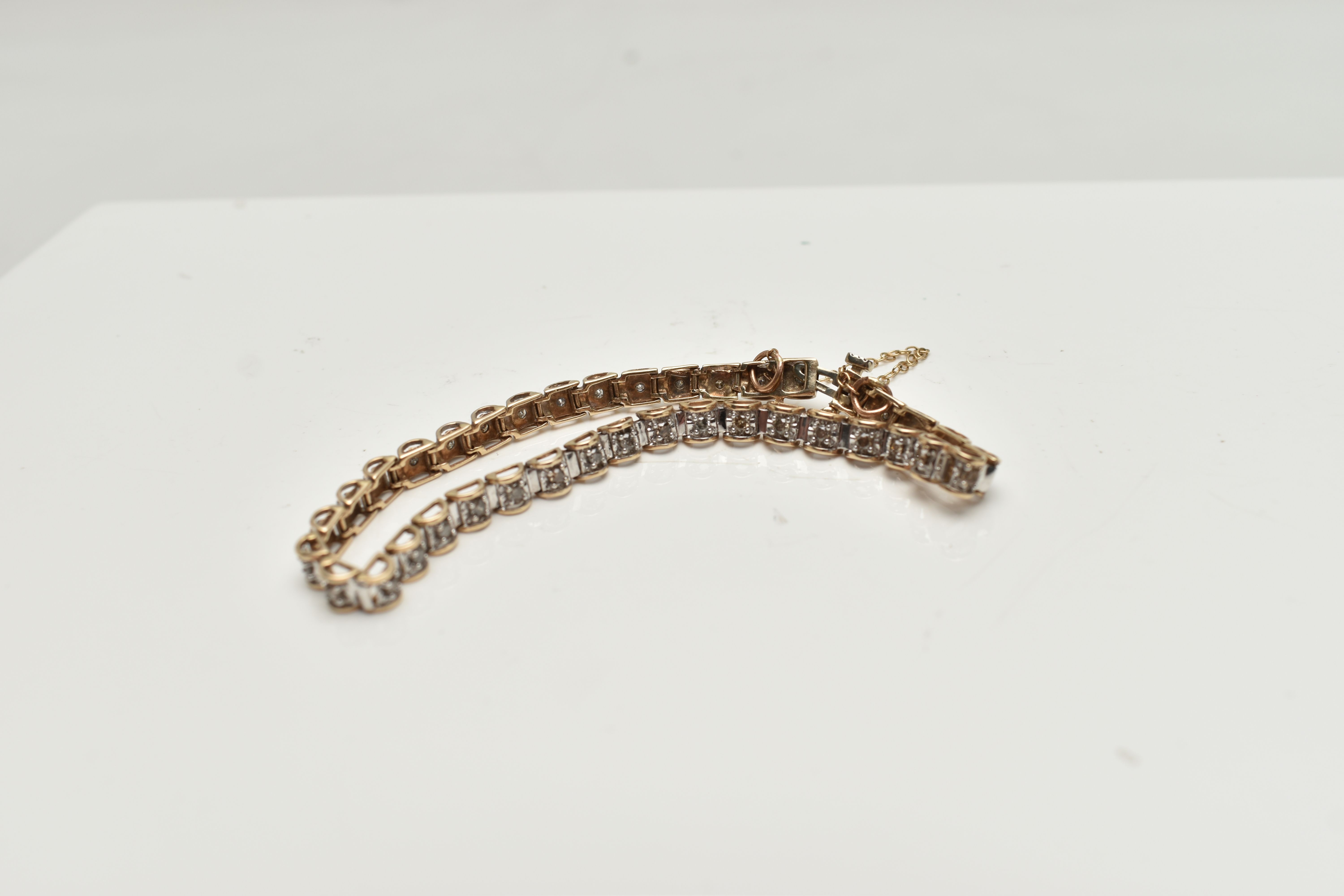 A 9CT GOLD DIAMOND LINE BRACELET, designed as a series of box links each set with a small round - Image 2 of 3