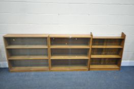 TWO OAK THREE TIER GLAZED BOOKCASES, width 92cm x depth 23cm x height 86cm, and an open bookcase (