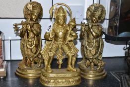 THREE GILT METAL RELIGIOUS HINDU FIGURES, comprising Lord Hanuman, height 30cm, and two figures of