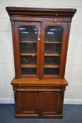 A VICTORIAN MAHOGANY BOOKCASE, with double glazed doors, width 104cm x depth 43cm x height 205cm x