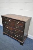 A GEORGE III MAHOGANY CHEST OF TWO OVER THREE LONG DRAWERS, with a quarter book matched veneer