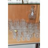 A SUITE OF TWENTY FOUR EDINBURGH CRYSTAL THISTLE PATTERN DRINKING GLASSES AND MATCHING DECANTER, the