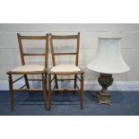 A MODERN GILT TABLE LAMP, with foliate decoration, and a fabric shade, along with two chairs (