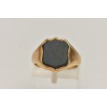 A 1920'S 15CT GOLD BLOODSTONE SIGNET RING, set with a central shield shape bloodstone to the tapered