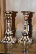 A PAIR OF ROYAL CROWN DERBY IMARI PATTERN CANDLE STICKS, square based, pattern number 2451, date