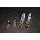 FOUR WOOD PLANES BY STANLEY AND RECORD comprising of a No 010 and 0220, a No 4 and a No 102 (4)