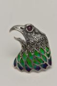 A WHITE METAL PLIQUE A JOUR BROOCH, in the form of an eagle head, set with a ruby cabcohon eye,