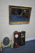 A GILT FRAMED BEVELLED EDGE WALL MIRROR, 90cm x 65cm, two modern wall clocks, and a French triple