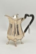 AN EDWARDIAN SILVER HOT WATER JUG OF QUATREFOIL FORM, ebonised handle, on four cabriole legs with