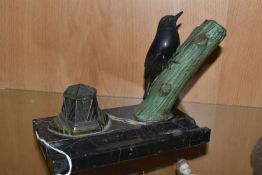 A FRENCH ART DECO DESK STAND WITH CAST METAL BIRD ON A BRANCH, indistinct cast signature,