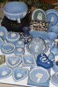 A QUANTITY OF WEDGWOOD BLUE JASPERWARE, comprising a Ronson table lighter, a boxed fruit bowl, a