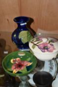 THREE PIECES OF MOORCROFT POTTERY, comprising a Magnolia pattern covered pot, a Clematis vase height