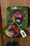 TWO PIECES OF 'HIBISCUS' PATTERN MOORCROFT POTTERY, comprising a small squat vase, height 7cm, and a