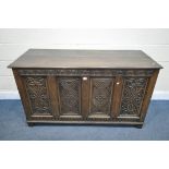 A GEORGIAN CARVED OAK PANELLED COFFER, width 141cm x depth 56cm x height 79cm (condition report:-