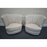 A PAIR OF ART DECO CREAM LEATHER CLOUD CHAIRS, on casters (condition report report:-leather finish