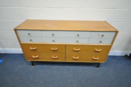 A MID CENTURY GOLDEN OAK E-GOMME/G-PLAN BRANDON RANGE, CHEST OF DRAWERS/SIDEBOARD, with an