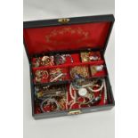 A JEWELLERY BOX WITH COSTUME JEWELLERY, black jewellery box with red interior, together with three