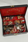 A JEWELLERY BOX WITH COSTUME JEWELLERY, black jewellery box with red interior, together with three