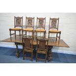 A 20TH CENTURY FRENCH OAK DRAW LEAF BRETON TABLE, on four carved caryatid figures, united by a H