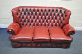 AN OXBLOOD LEATHER CHESTERFIELD SOFA, length 180cm (condition report:- no tears, crazing to