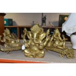 THREE GILT METAL FIGURES OF GANESHA, one seated, and two reclining, height of tallest 22cm (3) (
