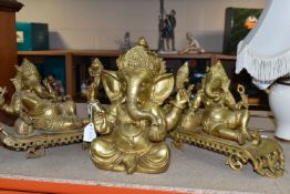 THREE GILT METAL FIGURES OF GANESHA, one seated, and two reclining, height of tallest 22cm (3) (