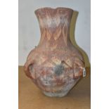 A PAINTED TERRACOTTA FOUR HANDLED URN, POSSIBLY CHINESE OF NEOLITHIC STYLE, decorated with geometric